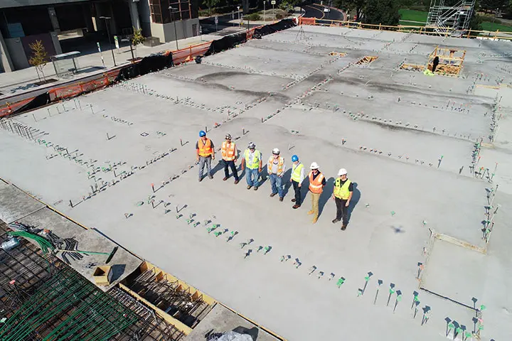 Workers are standing on construction site