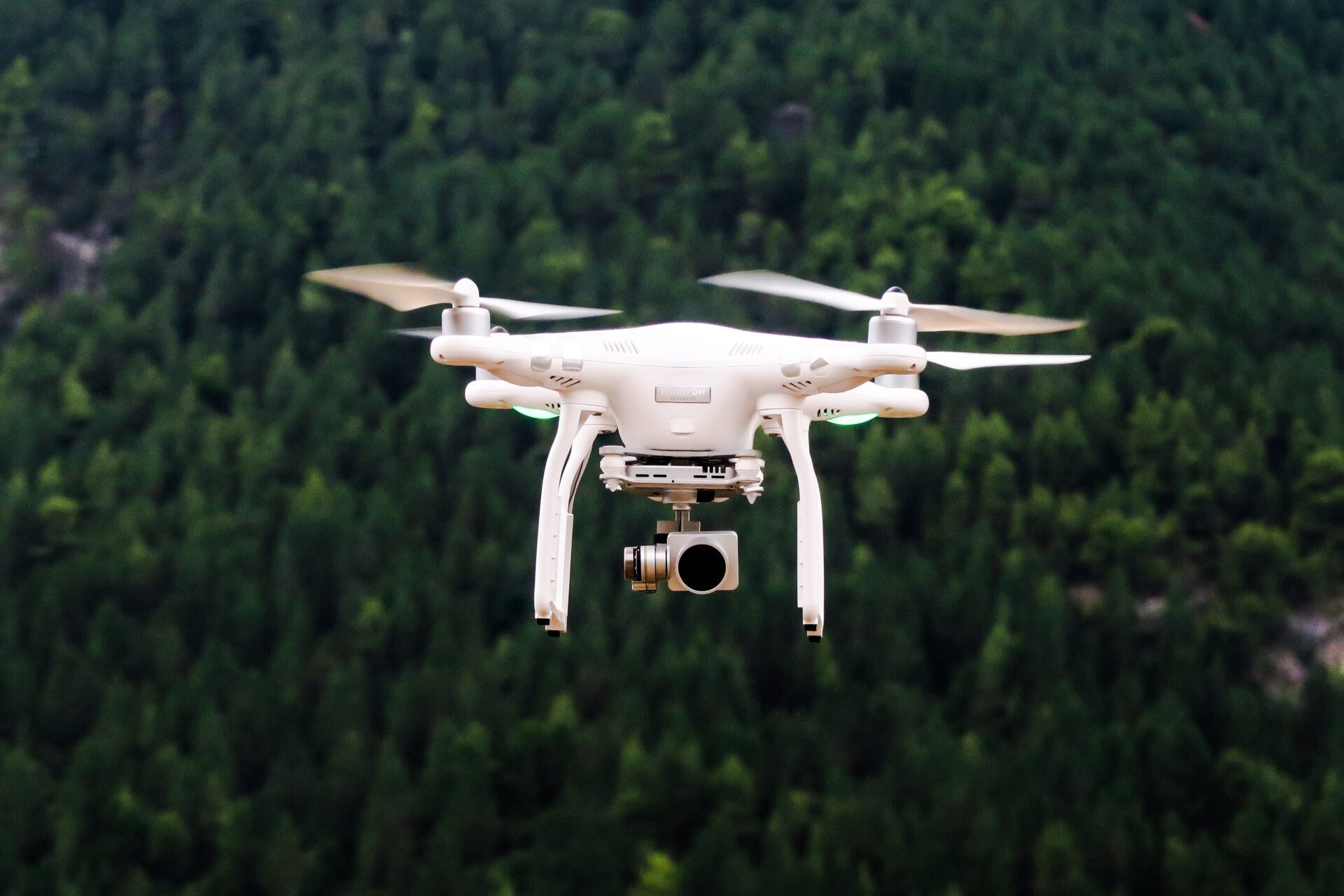 A close up picture of drone with trees in a background